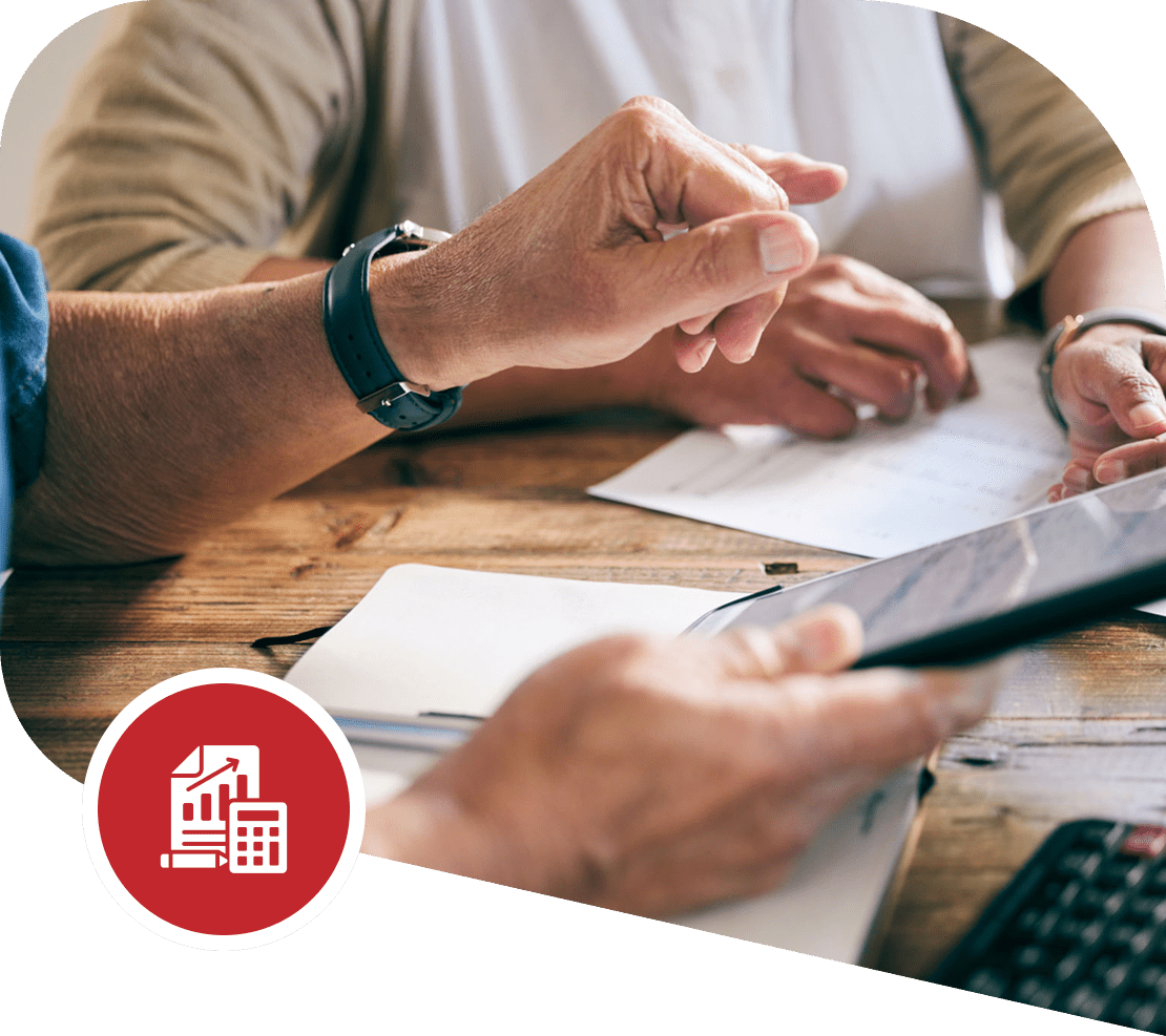 People discussing documents and using tablet.