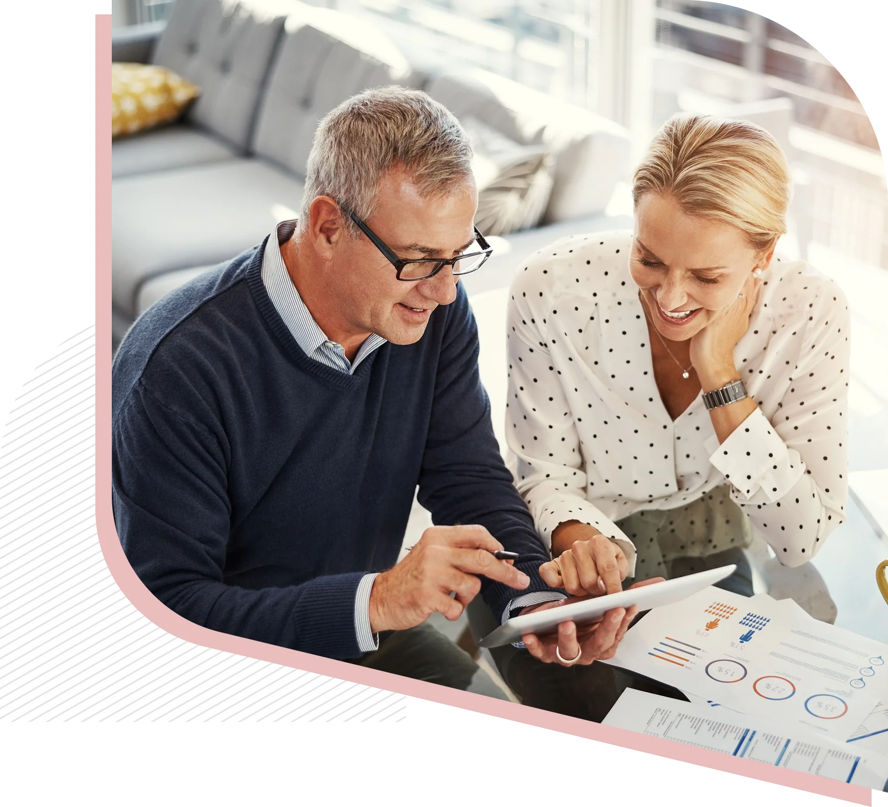 Man and woman discussing business charts.