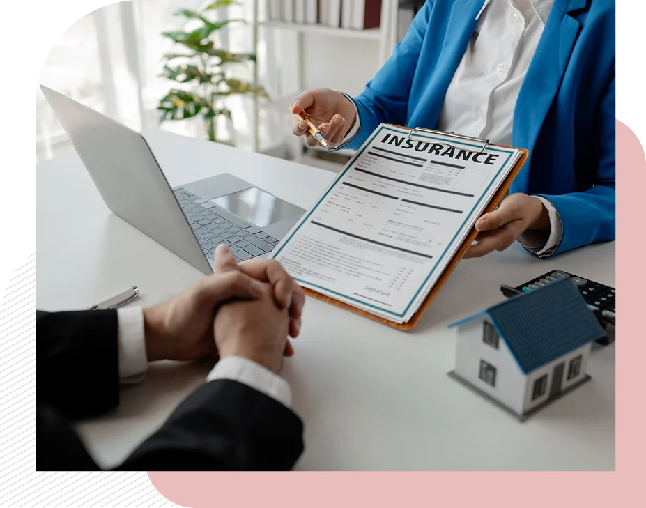 Insurance document discussion at office desk.